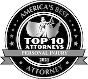 A black and white emblem with the text "America's Best Attorney, Top 10 Attorneys, Personal Injury, 2021." It features a central image of Lady Justice holding scales, set against the outline of the United States, surrounded by stars.