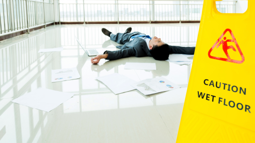 Person injured after slipping near wet floor sign in Florida office