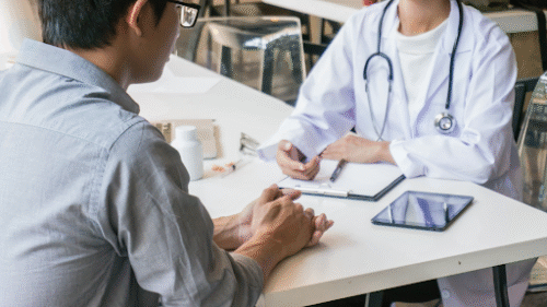 injured patient holding a medical device while consulting with a doctor
